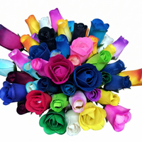 Bouquet of colorful artificial roses on a white background